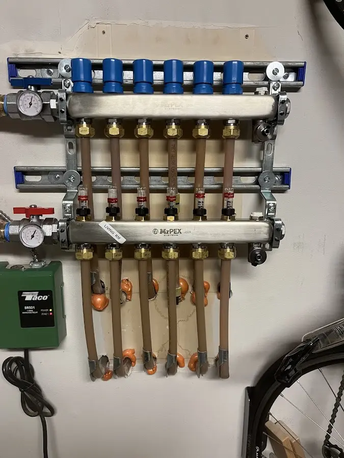 Plumber performing Water Heater Repair at a residential property in Evans