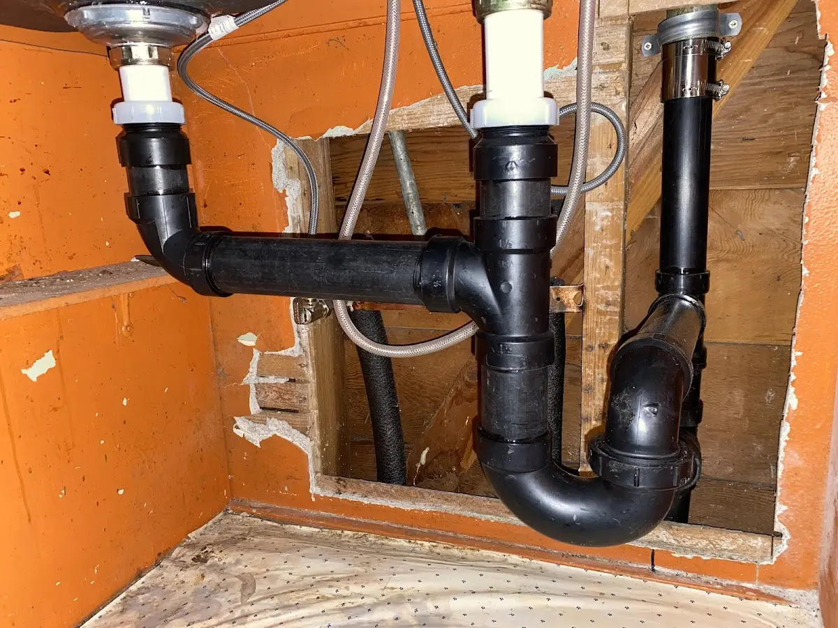 Professional Garbage Disposal Repair equipment and tools on the job in Evans